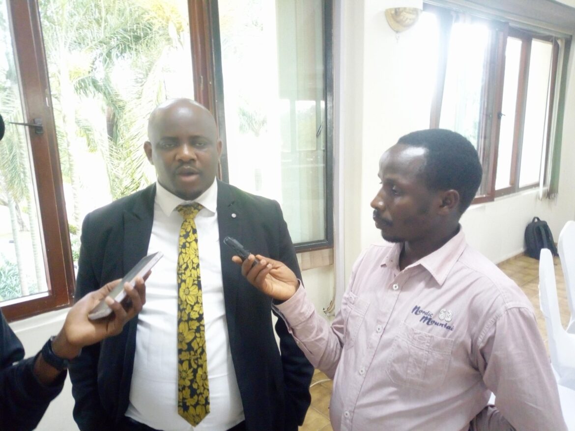 EMMANUEL ADDRESSING REPORTERS